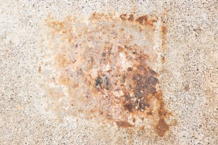 How to remove rust stains from concrete without damaging the surface